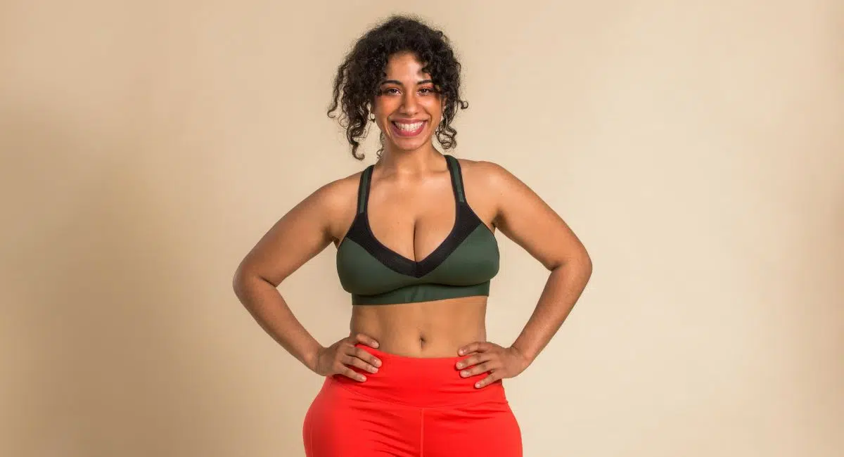 Cheerful attractive overweight woman in activewear