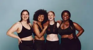 group of friends of different sizes smiling together
