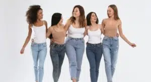 a group of women holding each other's waists while chatting
