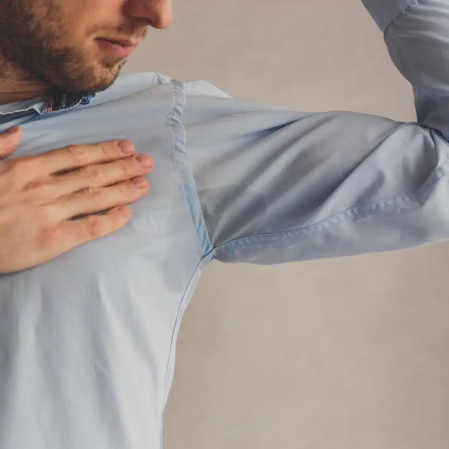 An image of a man having an underarm sweat that can be treated with Botox in Naples, Florida