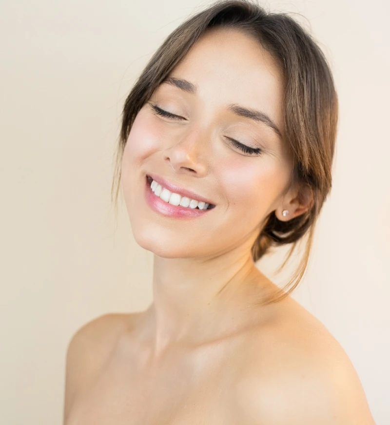 A girl showing her rejuvenated skin after getting the medspa treatment